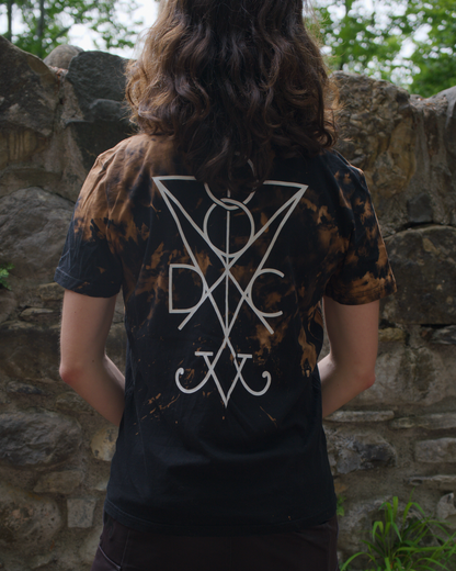 Person wearing a custom bleached black Dark Circles t-shirt with a white sigil on the back